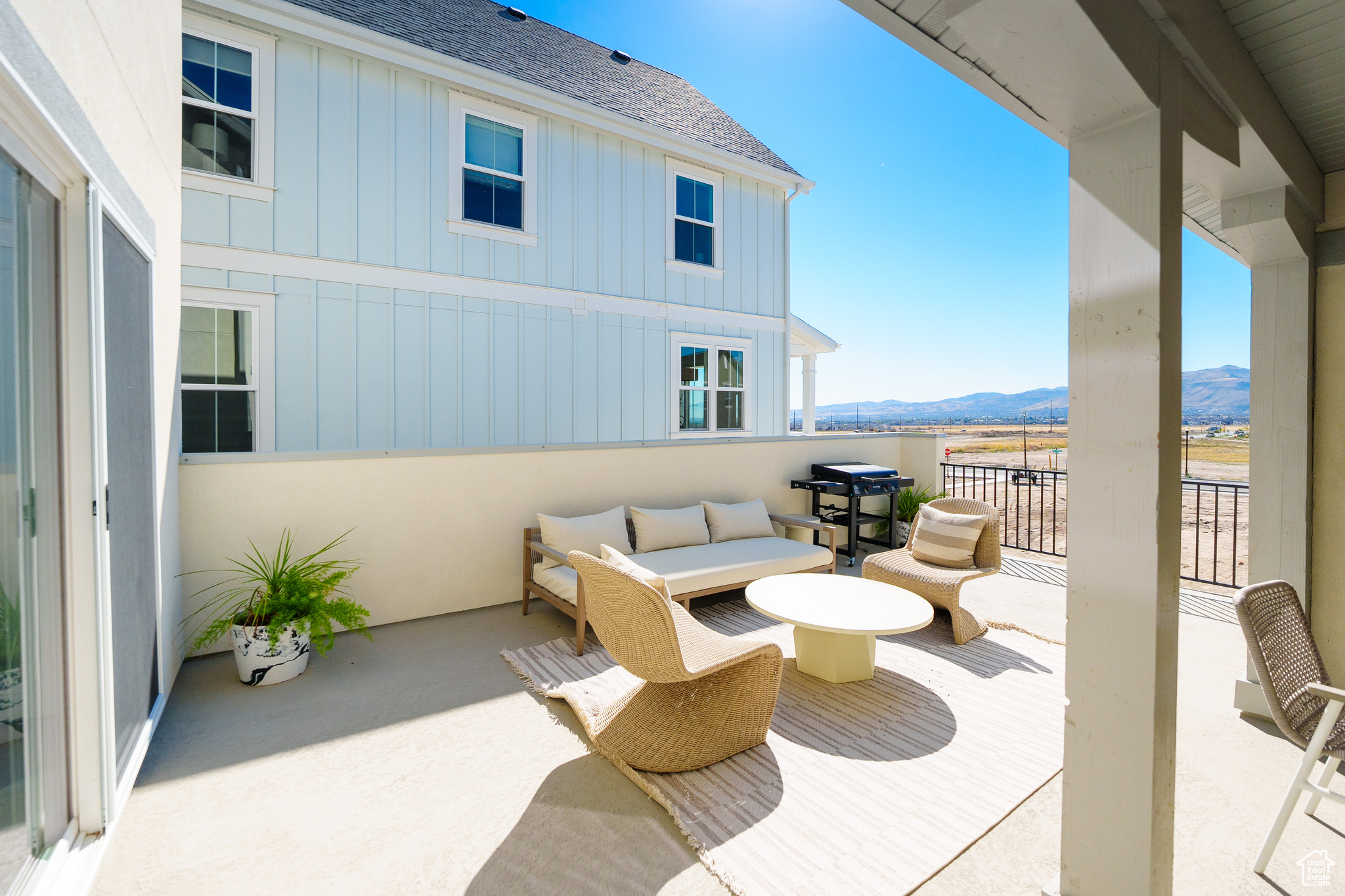 View of patio / terrace featuring an outdoor living space, a balcony, and a mountain view