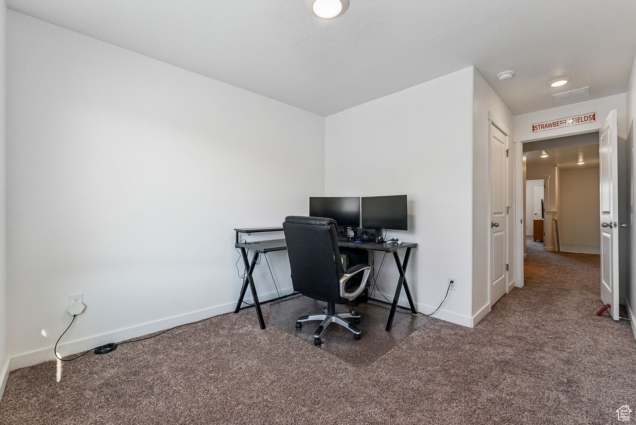 View of carpeted home office