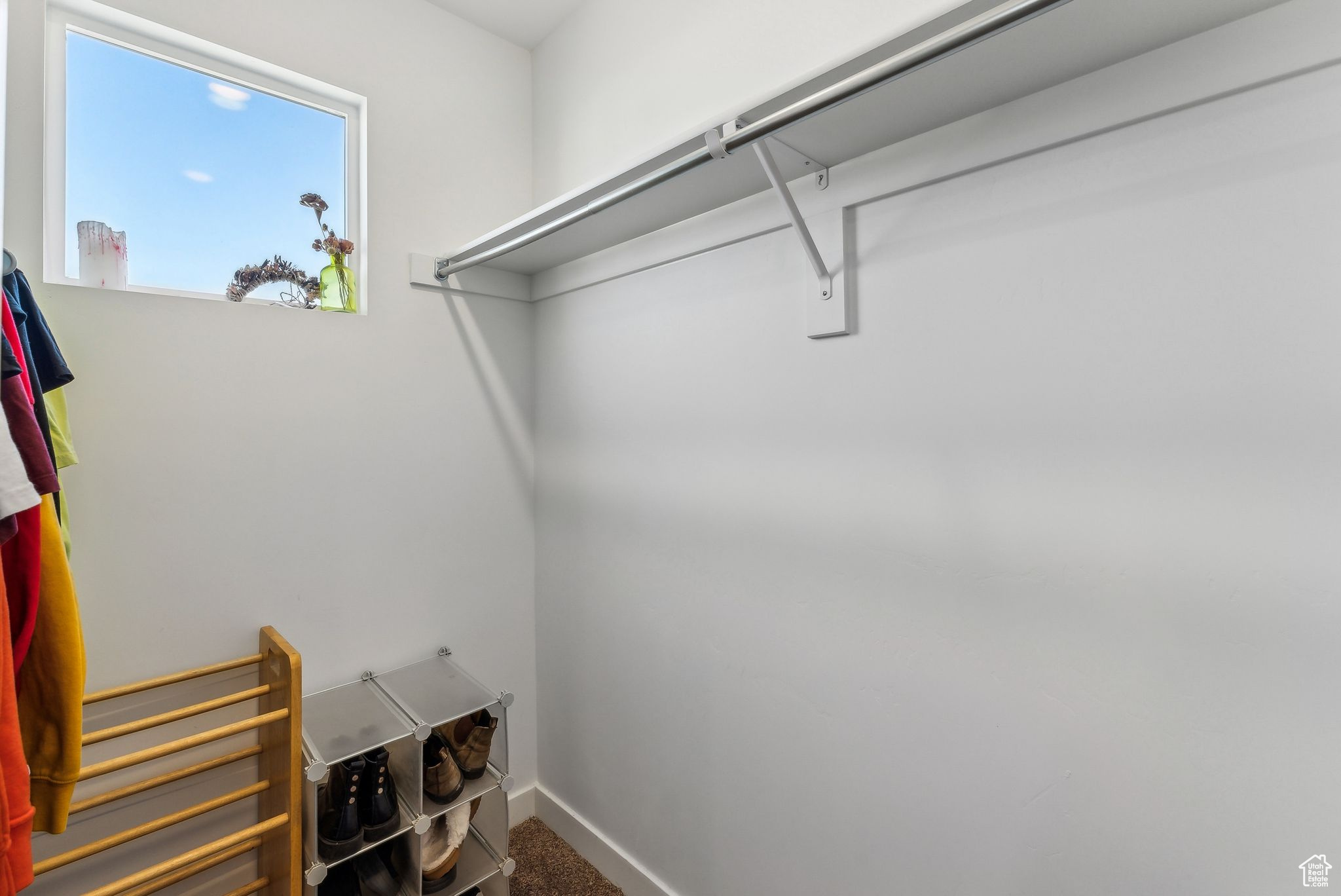 Spacious closet featuring carpet