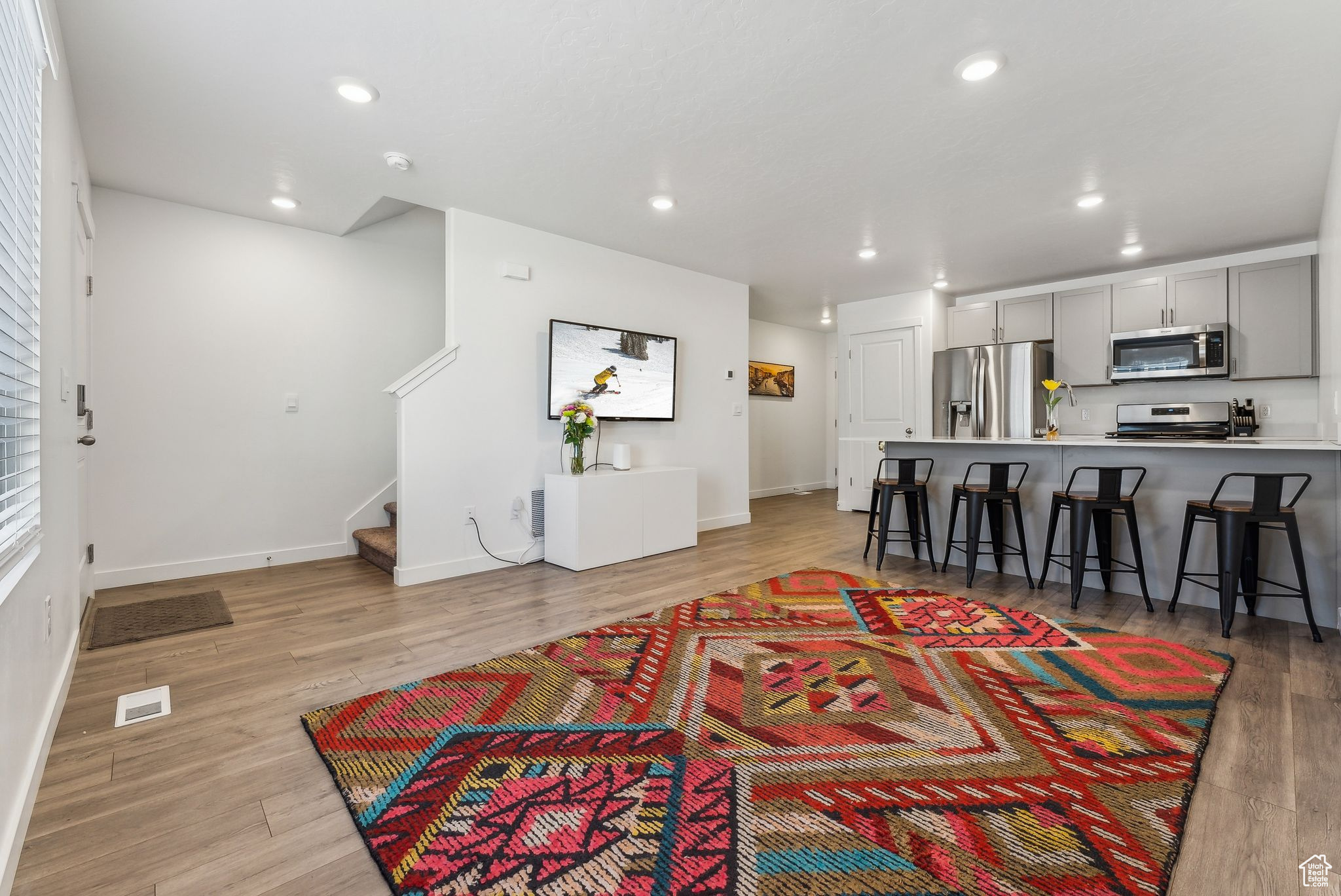 Living room with light hardwood / wood-style floors