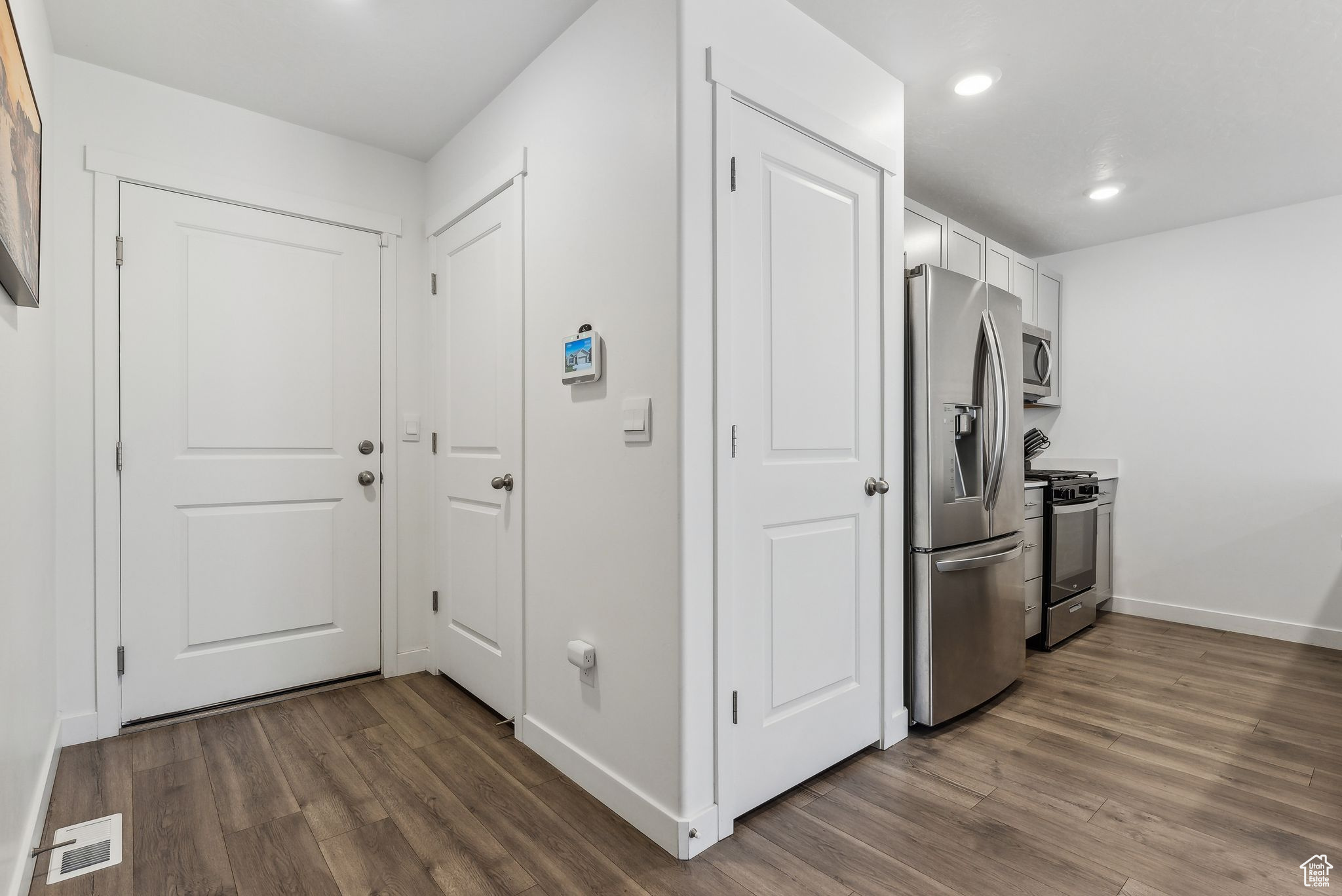 Hall with dark wood-type flooring