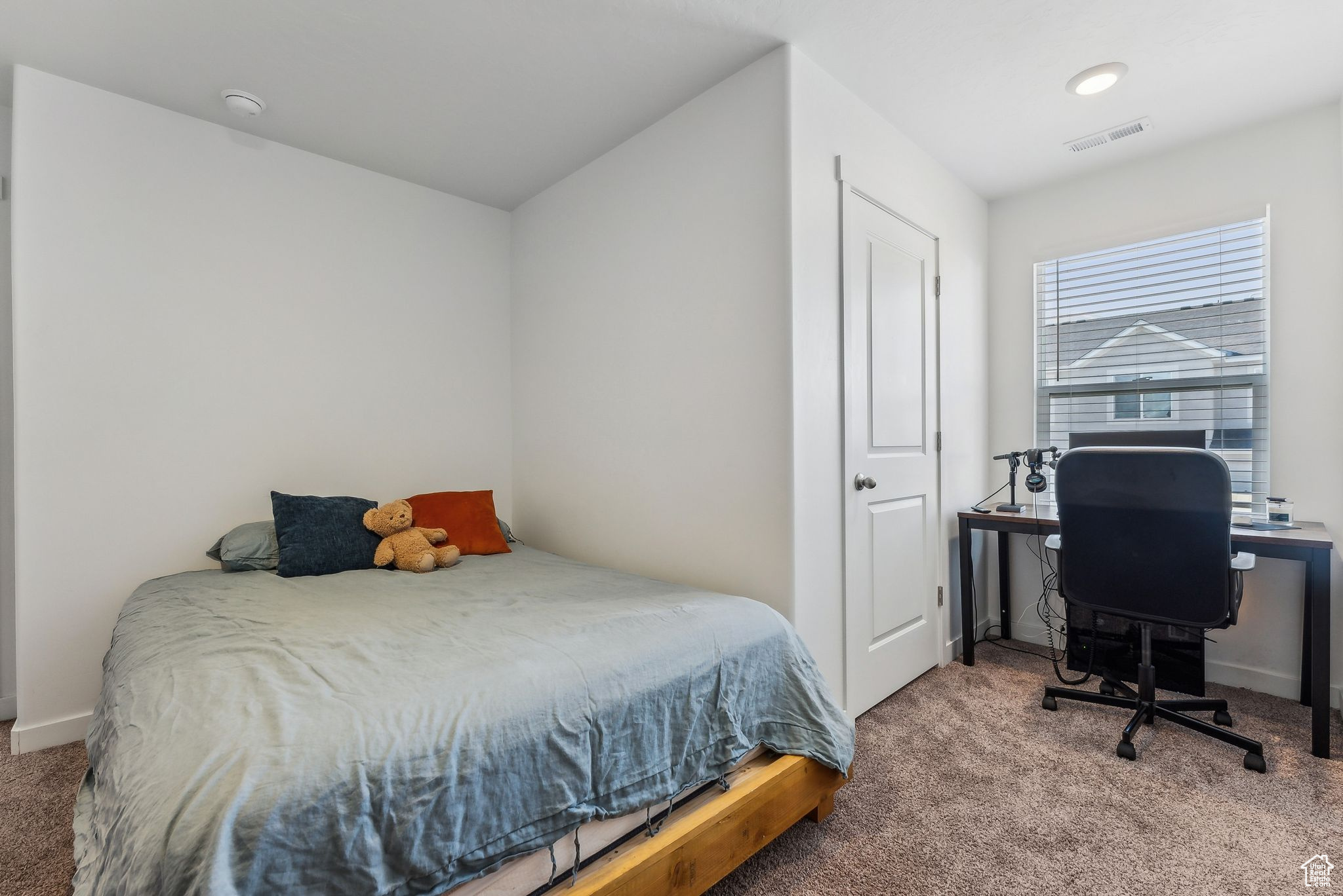 Bedroom featuring carpet floors