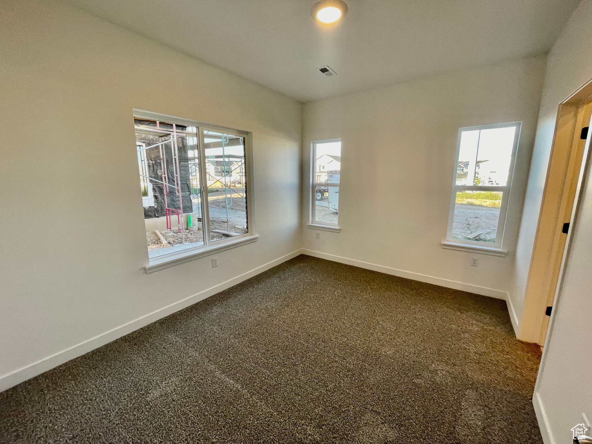 Unfurnished room featuring carpet floors