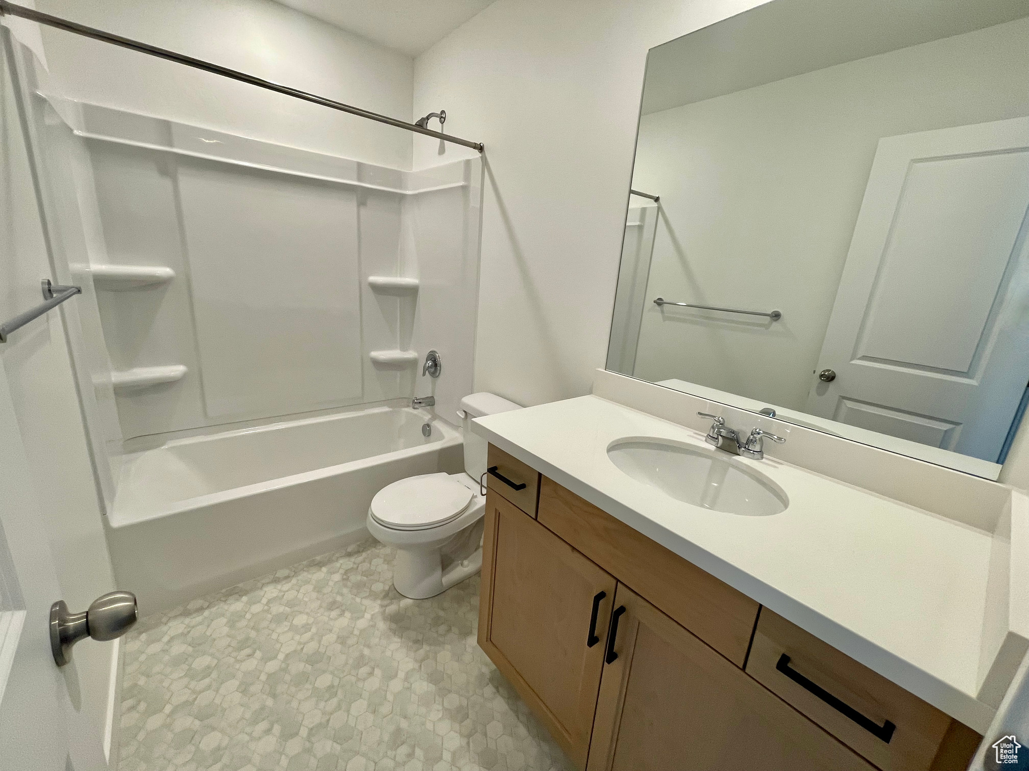 Full bathroom with toilet, shower / tub combination, and vanity