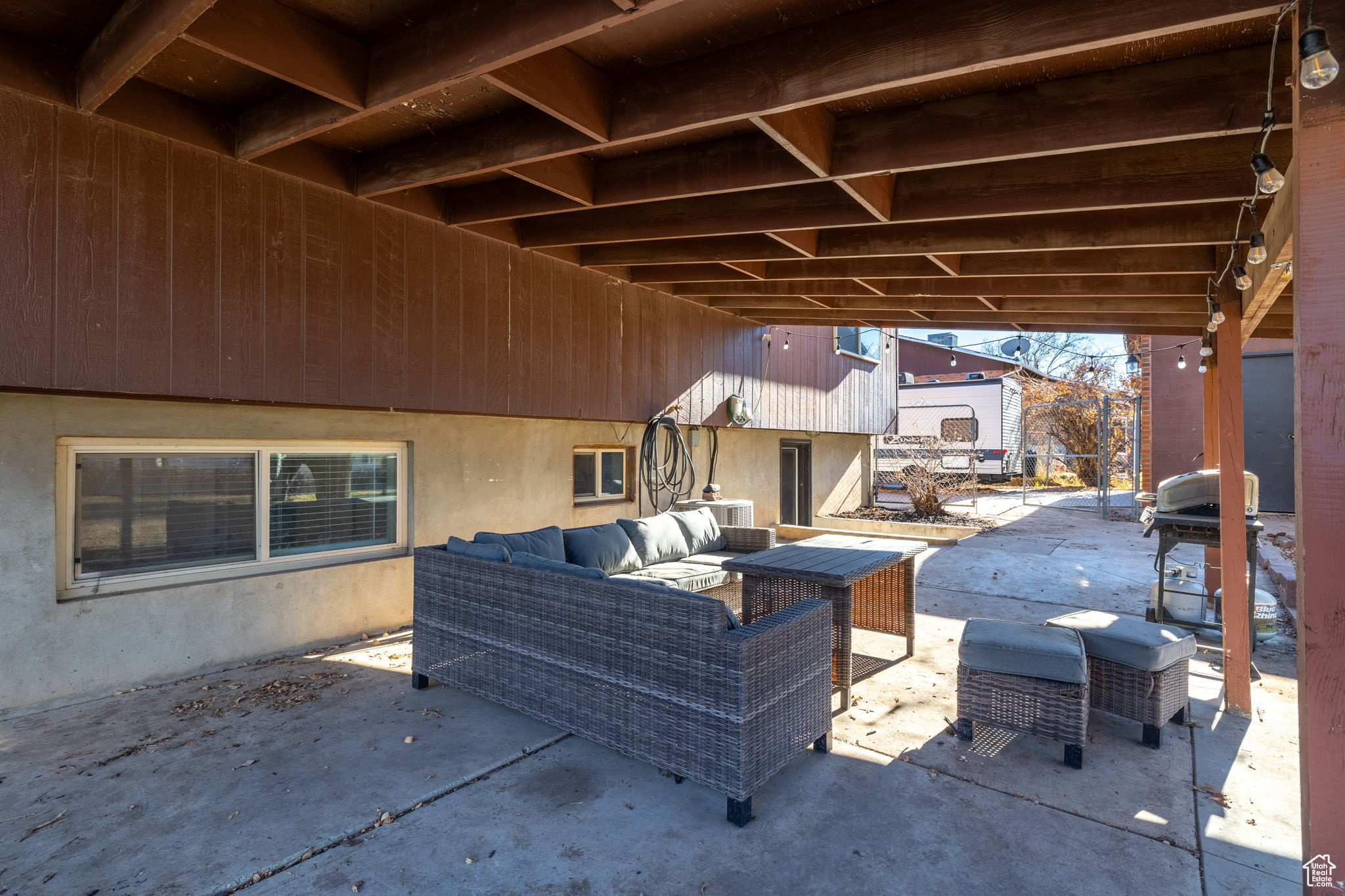 View of patio featuring an outdoor living space and a grill