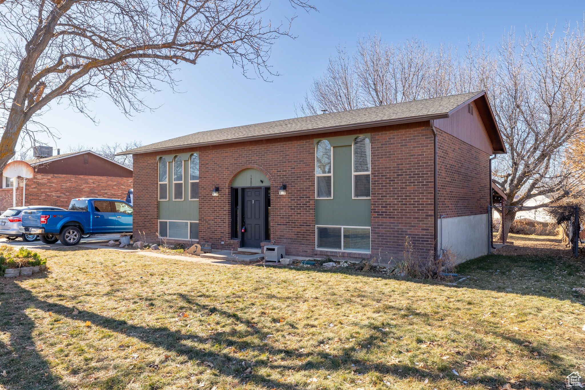 Split foyer home with a front yard