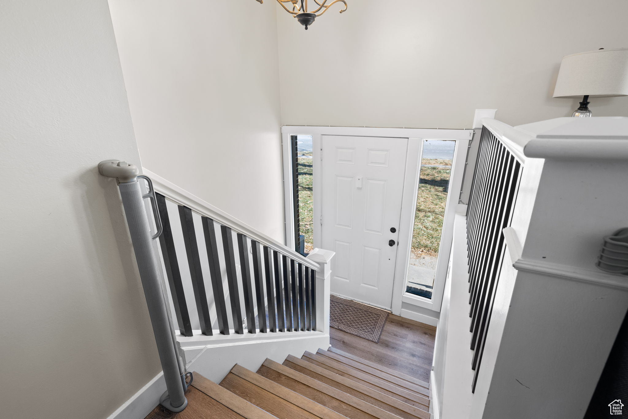 Entryway with hardwood / wood-style flooring and a healthy amount of sunlight