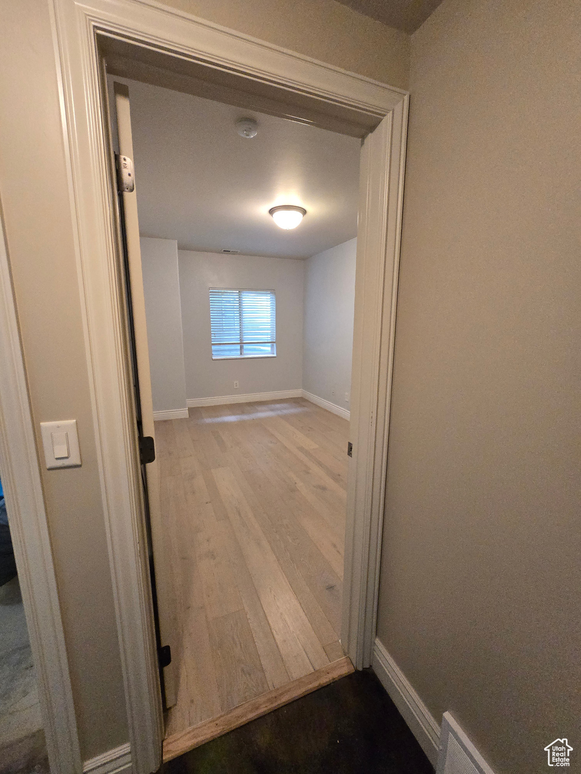 Hallway with light wood-type flooring