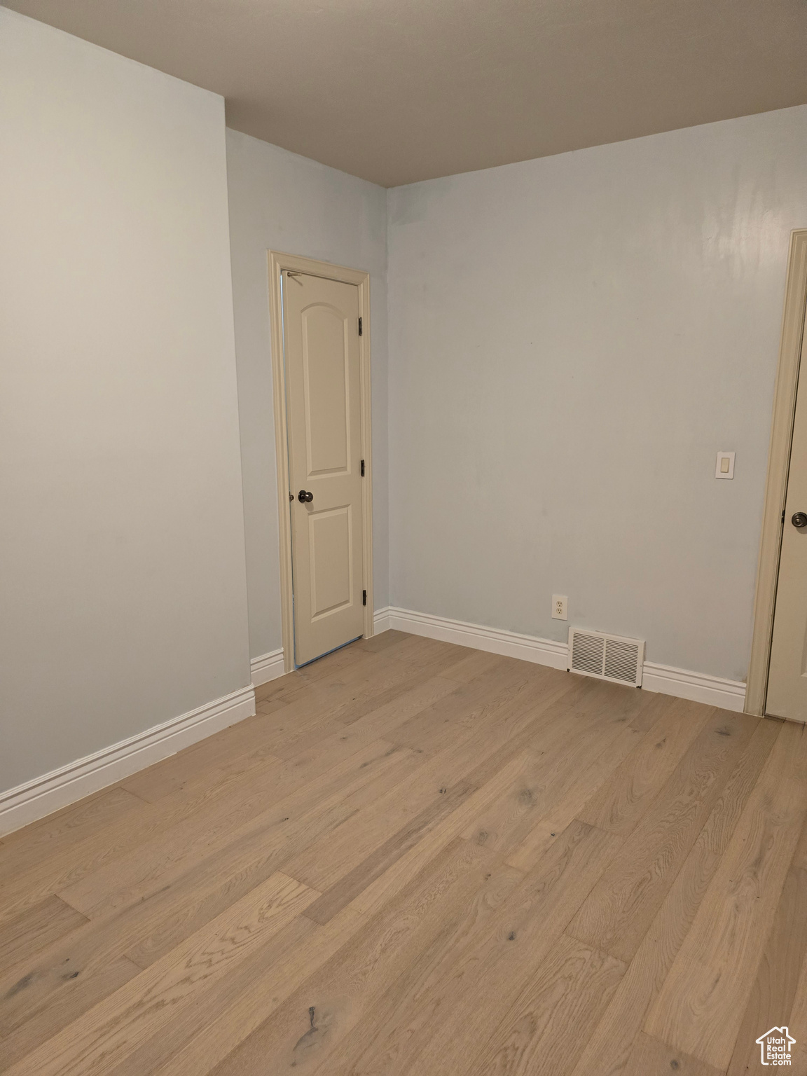 Spare room featuring light hardwood / wood-style floors