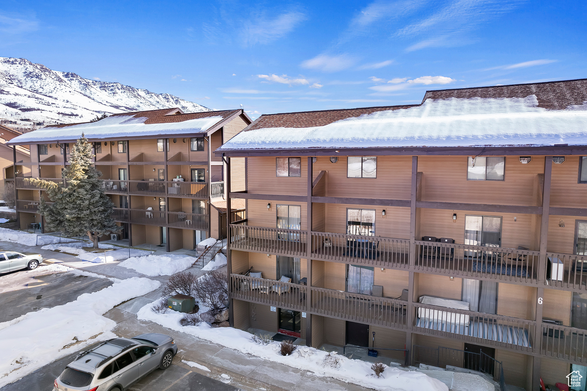 Snow covered building with a mountain view