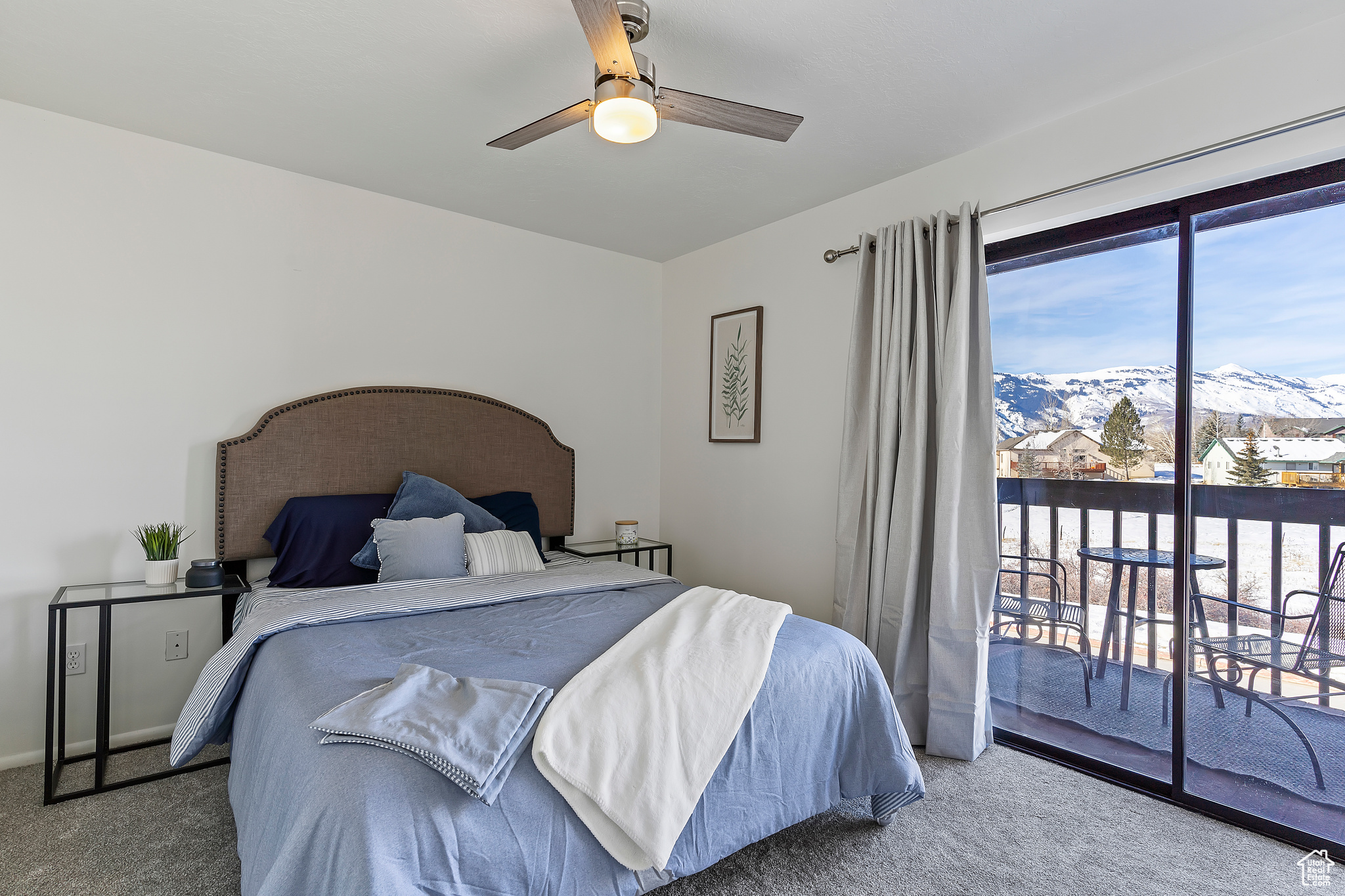 Bedroom with a mountain view, carpet flooring, access to outside, and ceiling fan