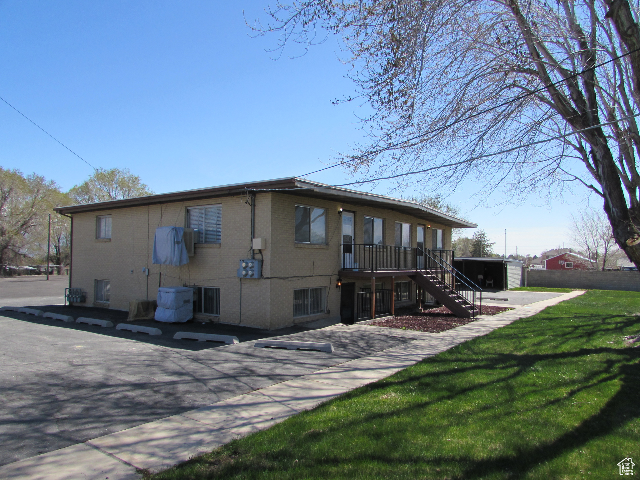 Rear view of house featuring a yard