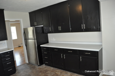 Kitchen with stainless steel fridge