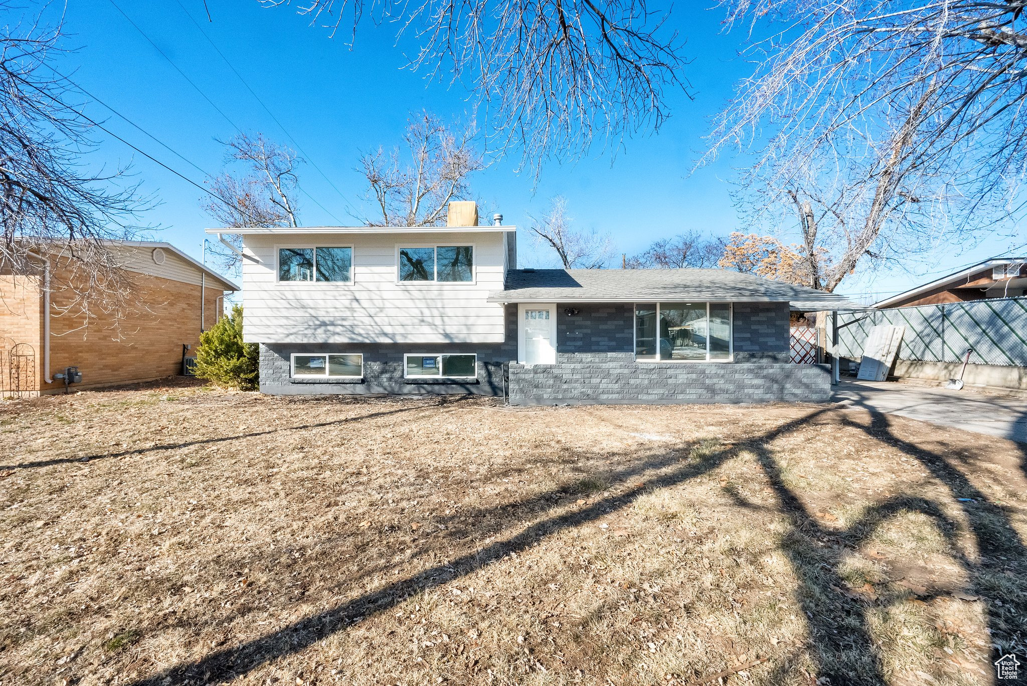 Split level home featuring a front yard