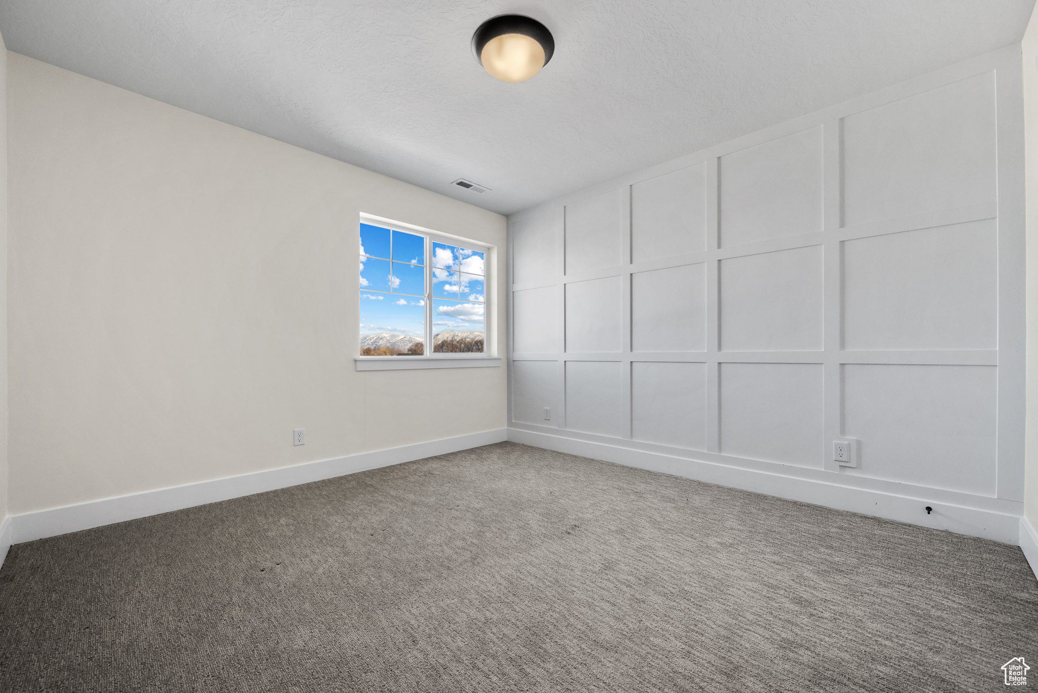 Unfurnished room featuring carpet floors