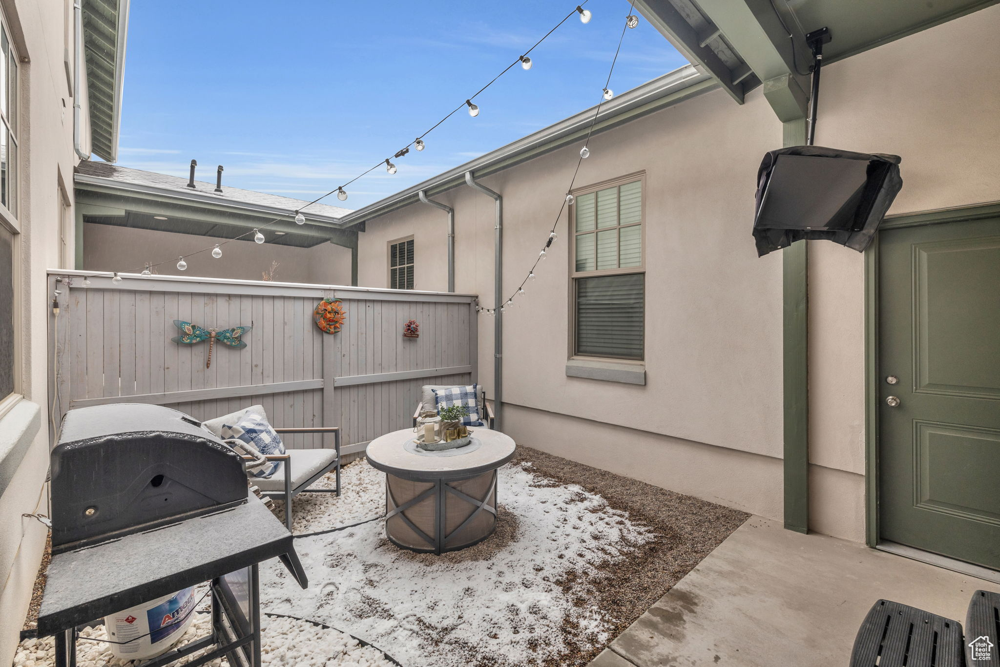 View of patio with a fire pit