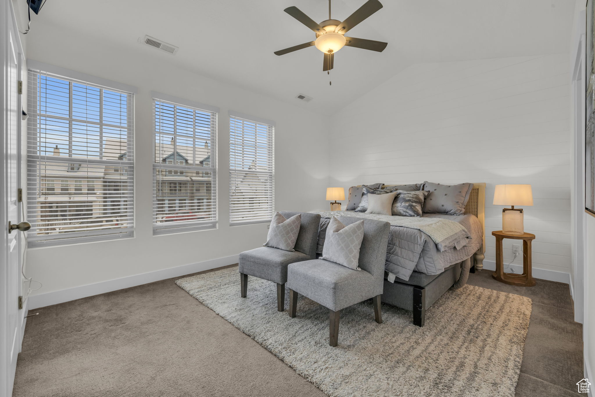 Bedroom with ceiling fan and lofted ceiling