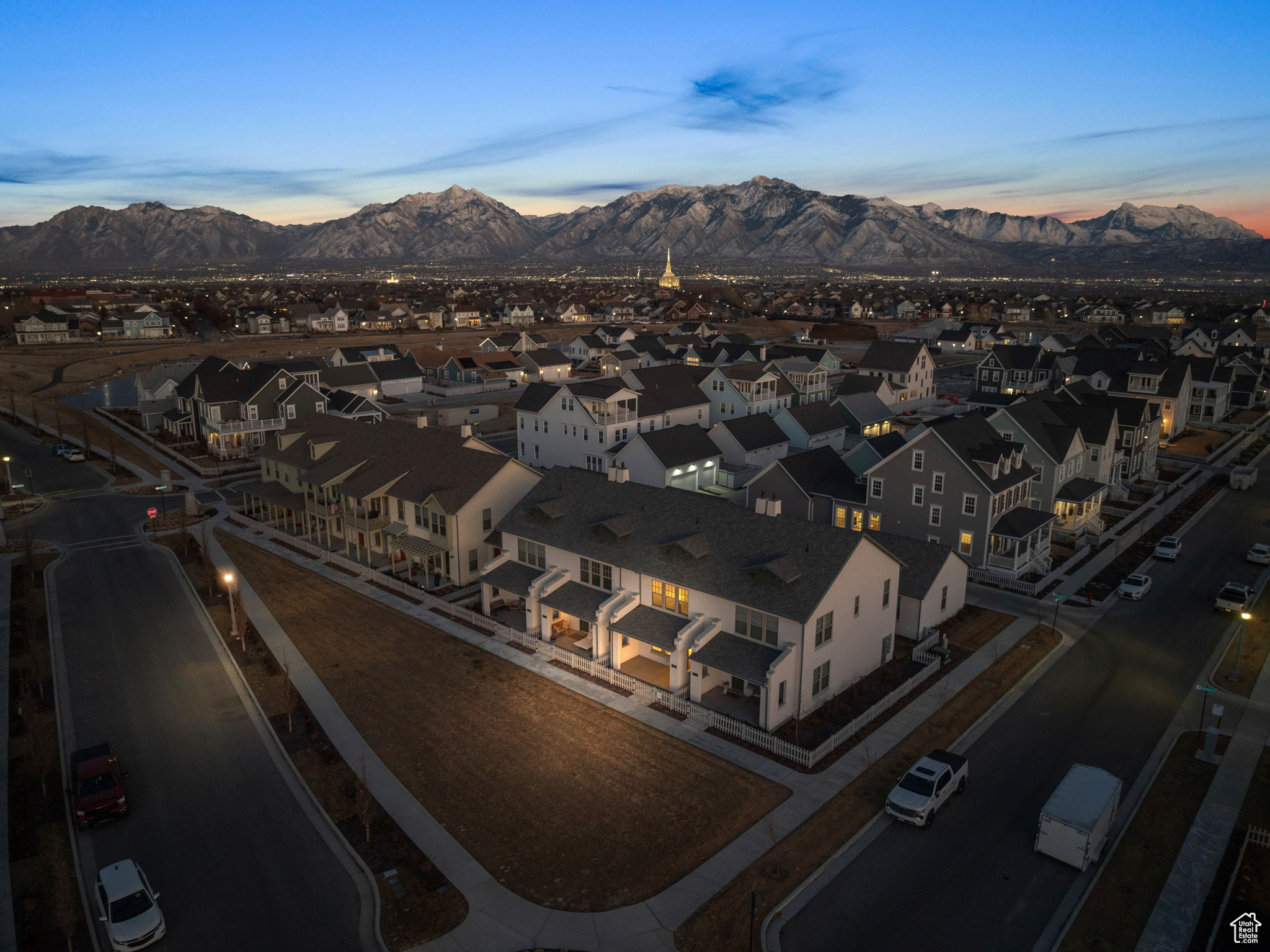 Aerial view at dusk featuring a mountain view