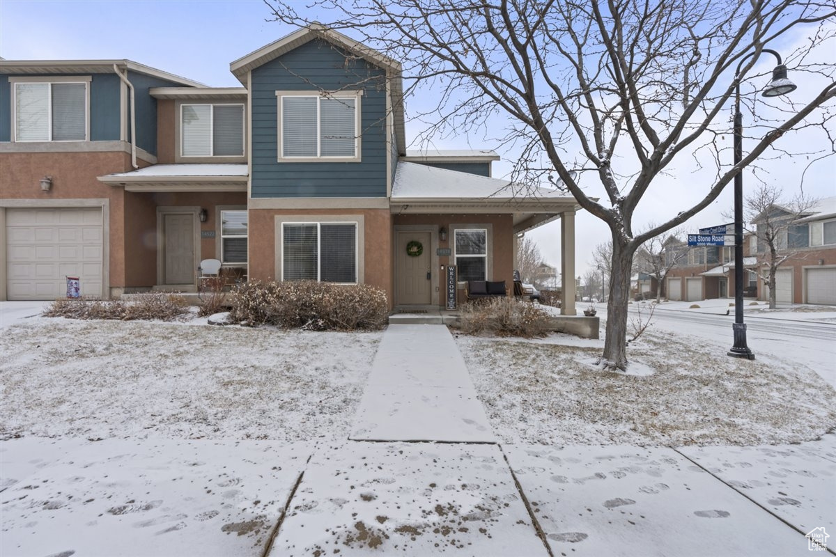 View of front of property with a garage