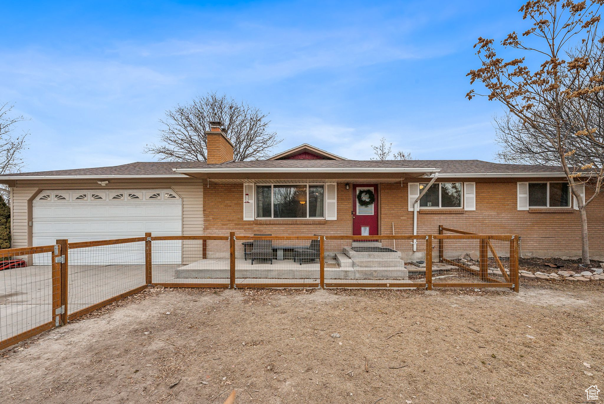 Ranch-style home featuring a garage