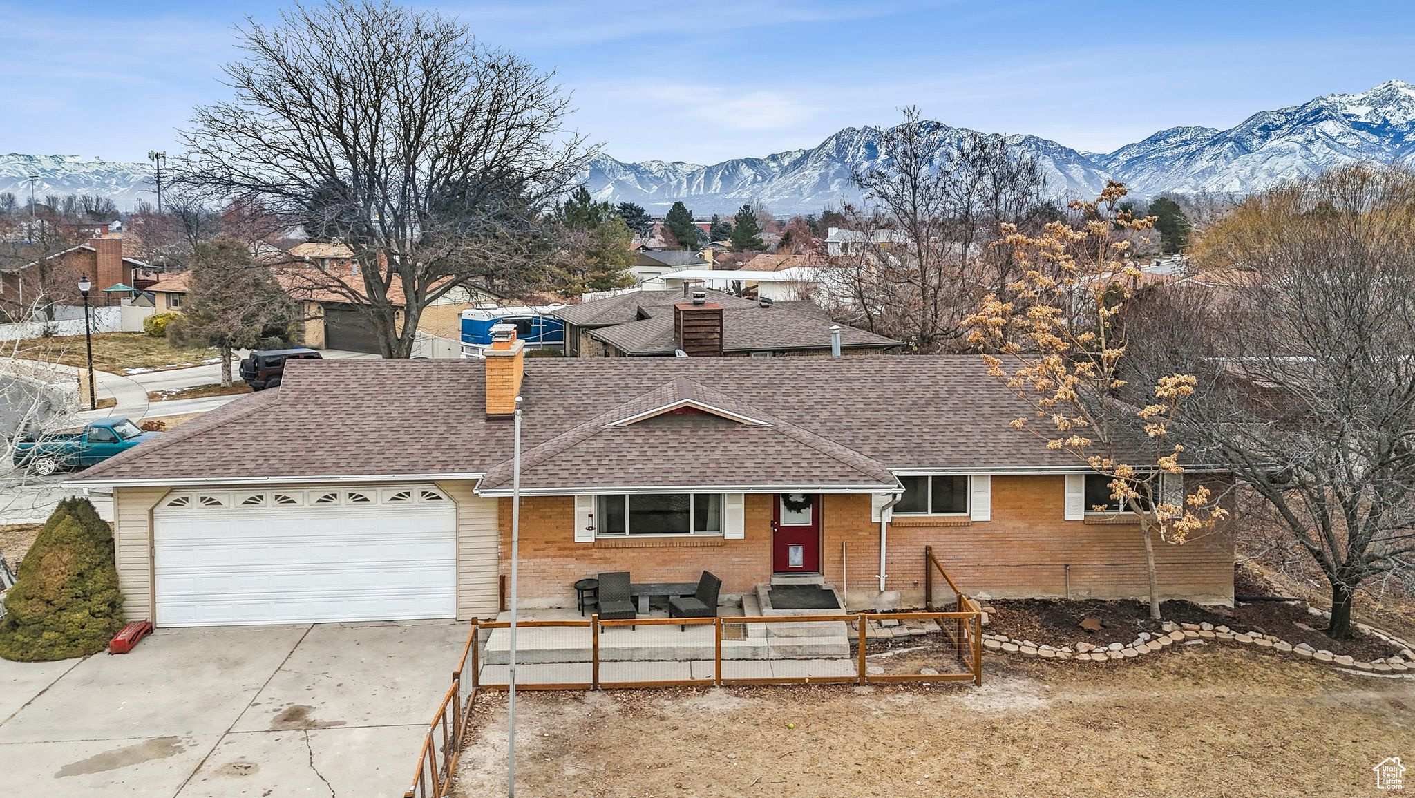 Ranch-style house featuring a mountain view and a garage