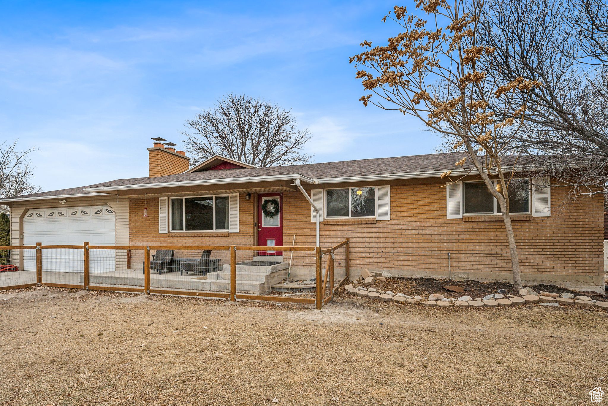 Ranch-style home featuring a garage