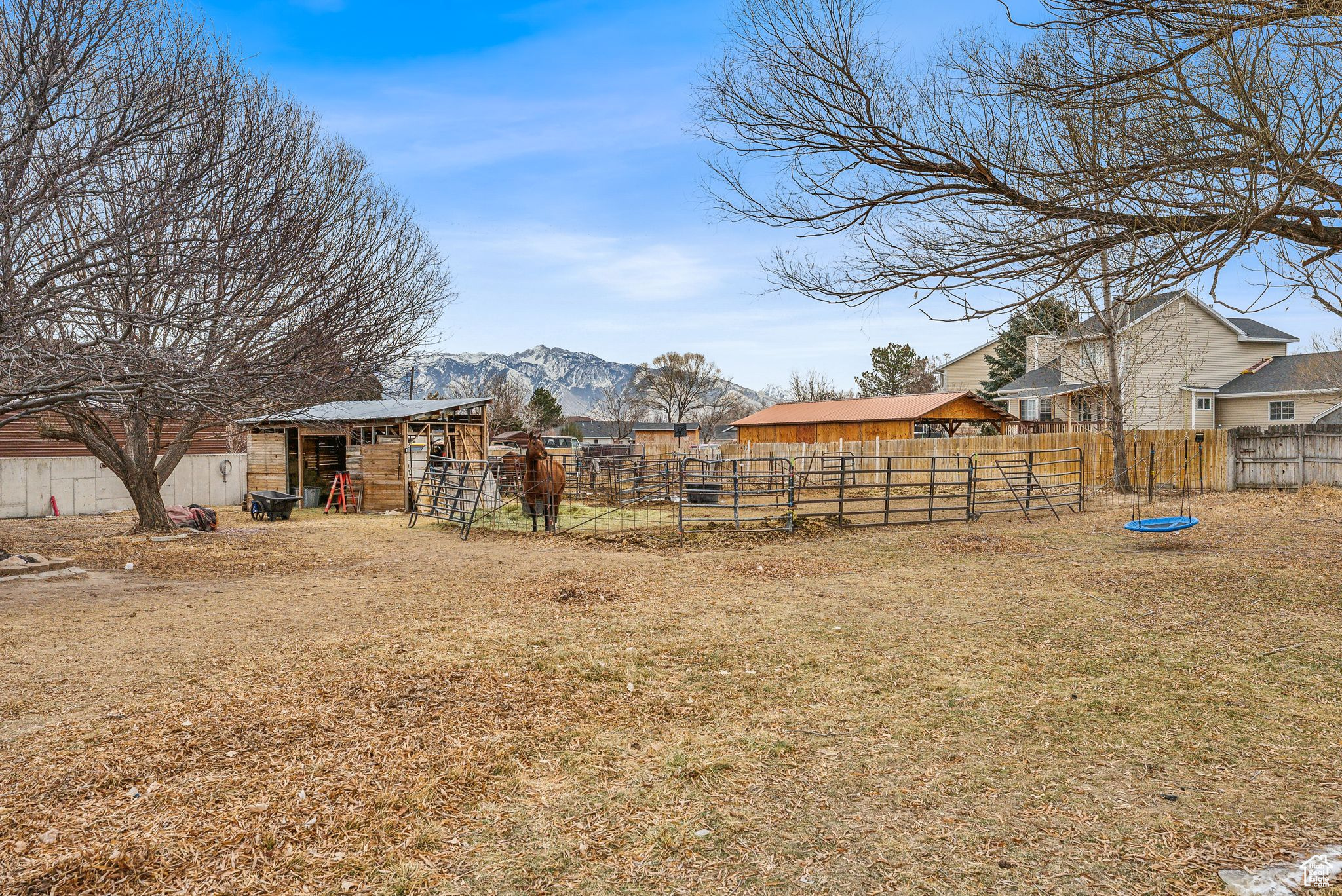 View of yard with an outdoor structure and a mountain view