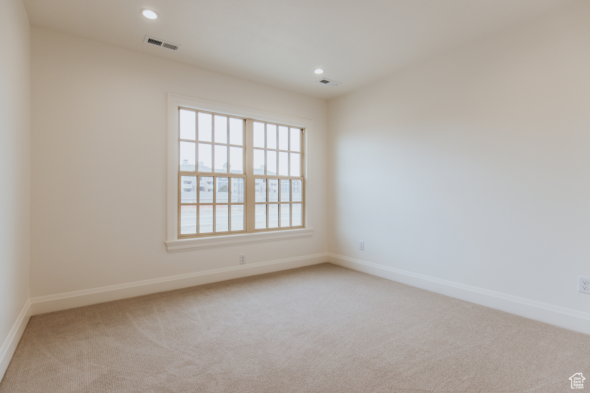 Empty room with carpet floors