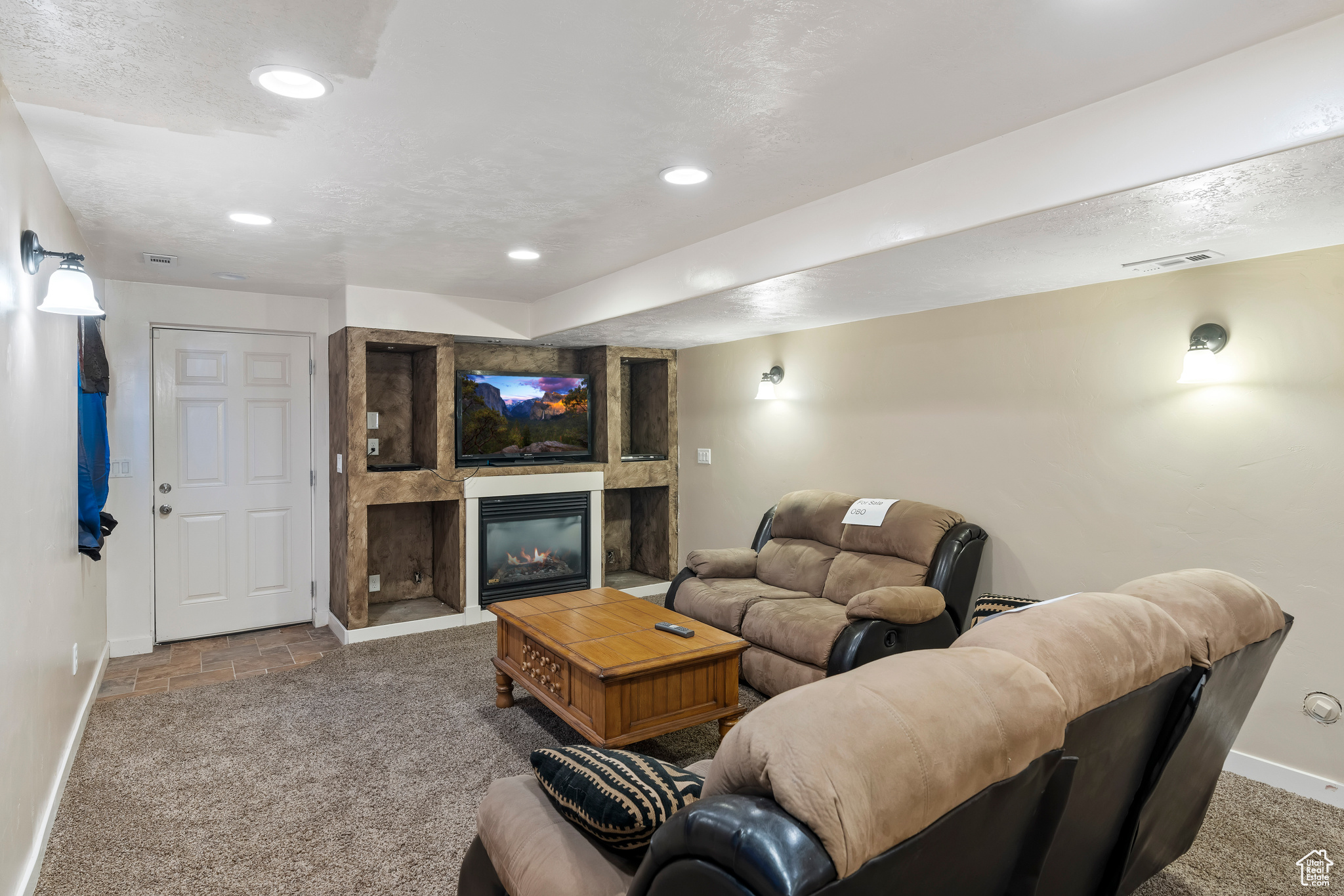 THE APARTMENT in the basement family room showing the door that leads out to the detached 4th garage and covered patio.