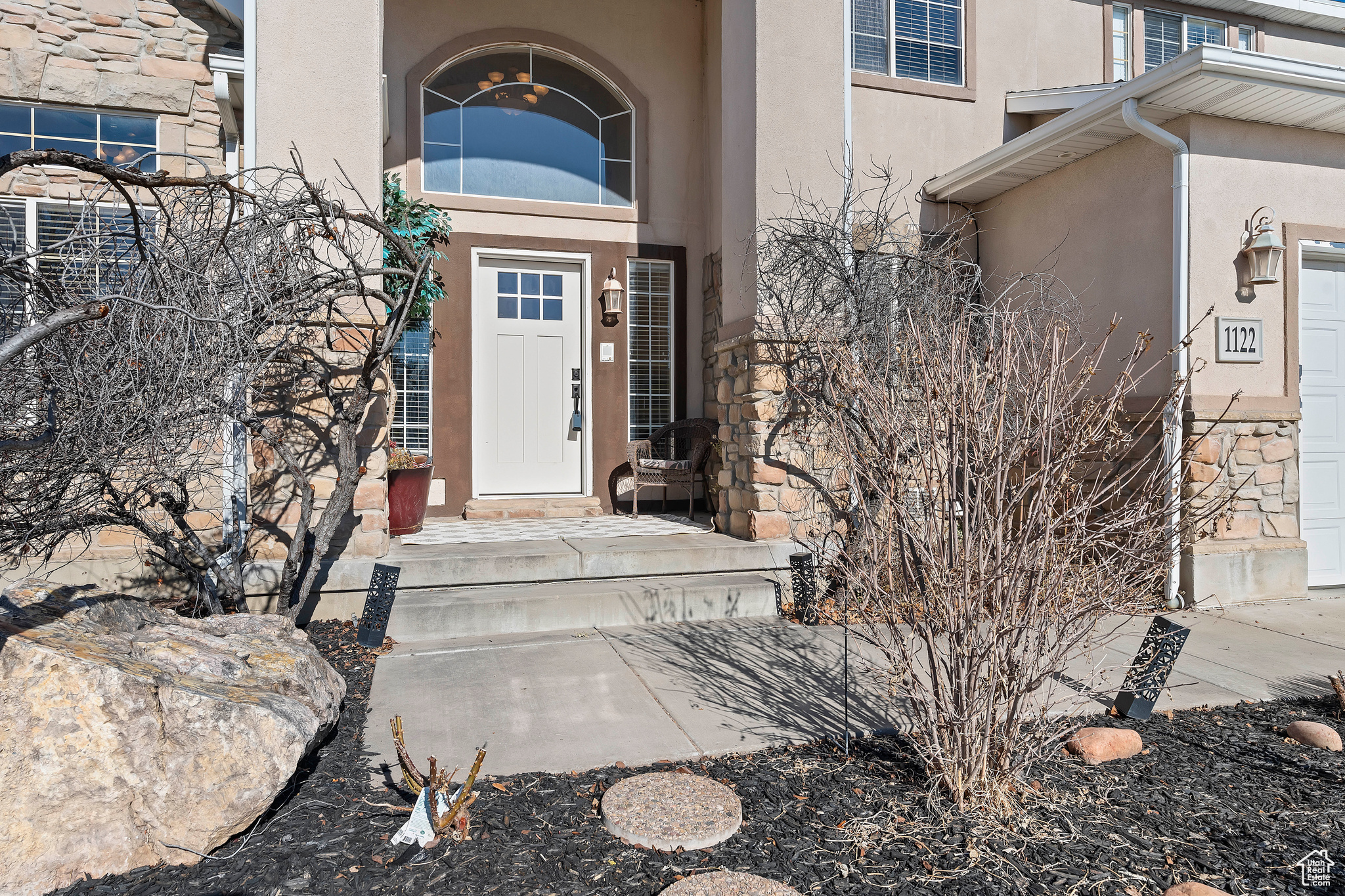 Entrance to property featuring a garage