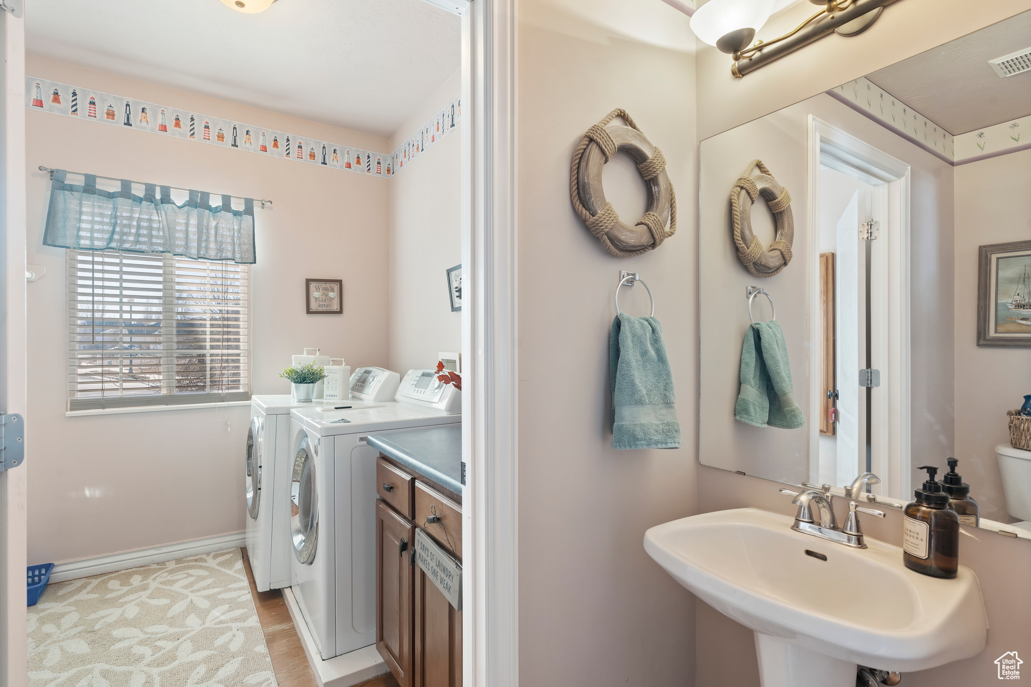 Laundry area featuring sink and washer and dryer