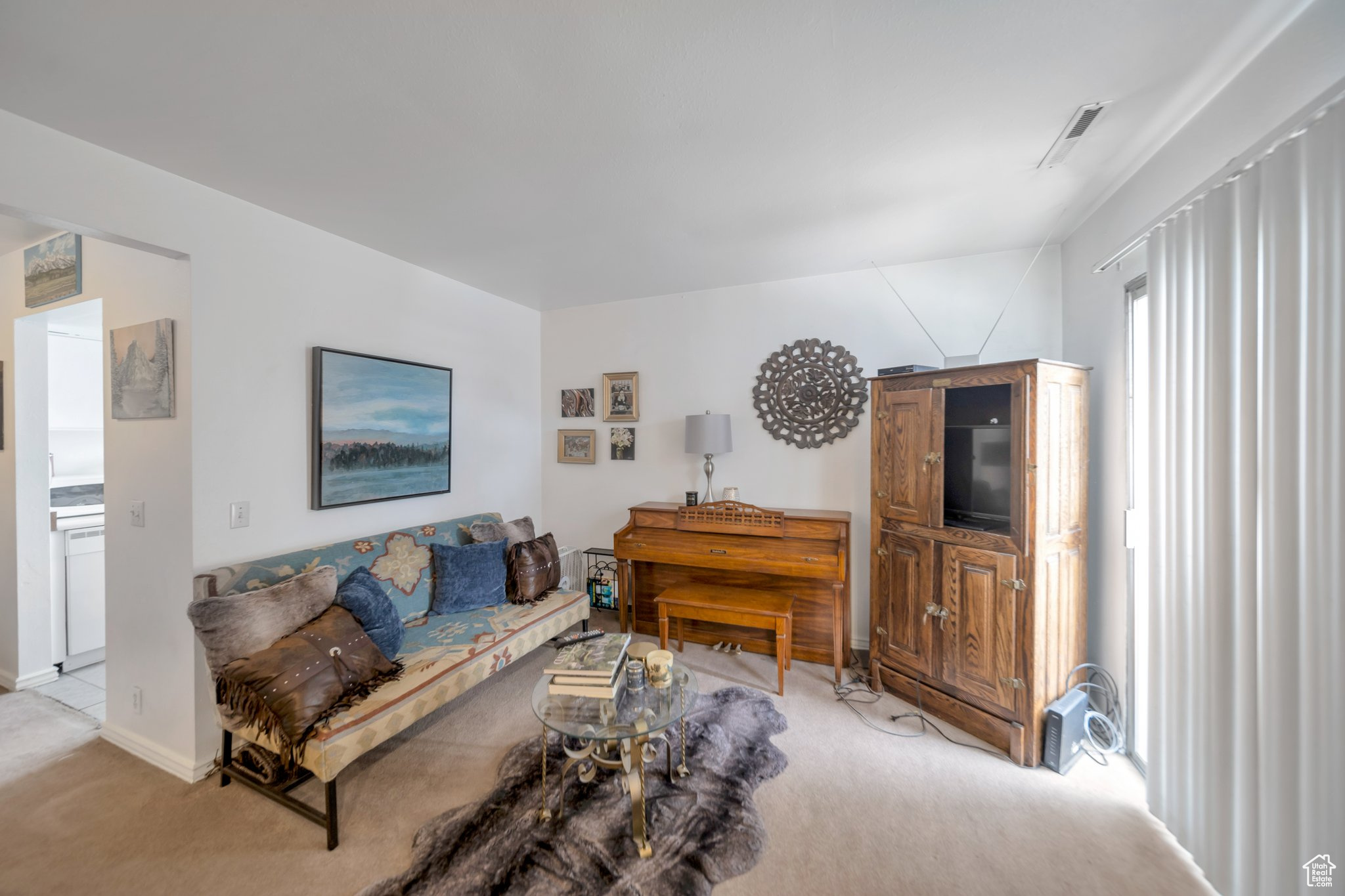 Living room featuring light carpet