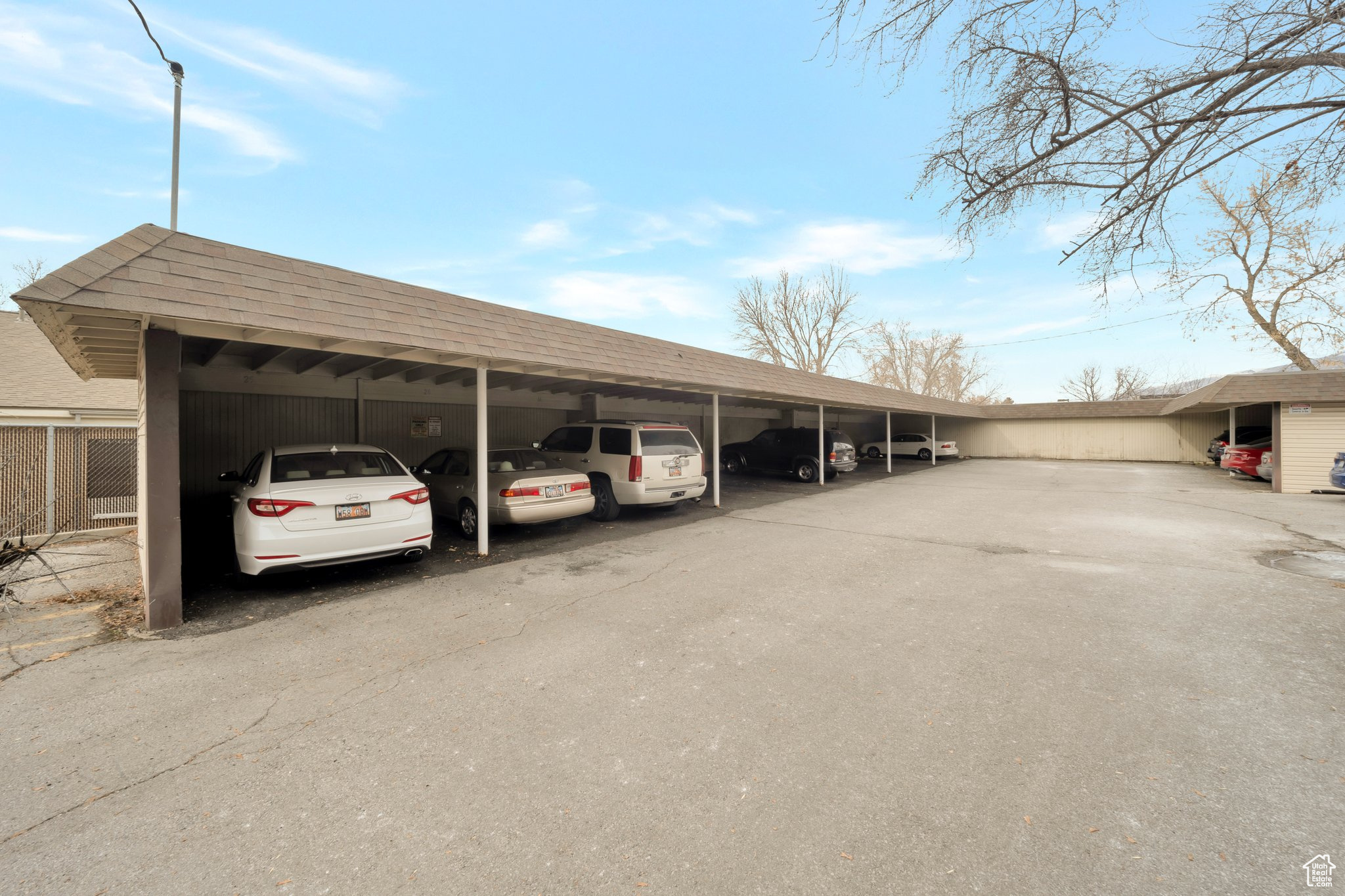 View of parking with a carport