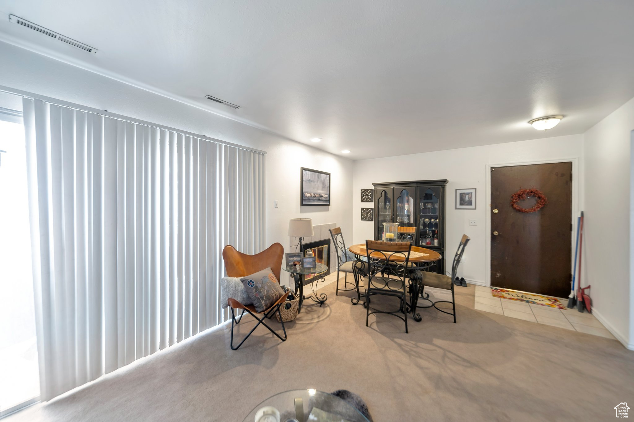 Dining area with light tile patterned floors