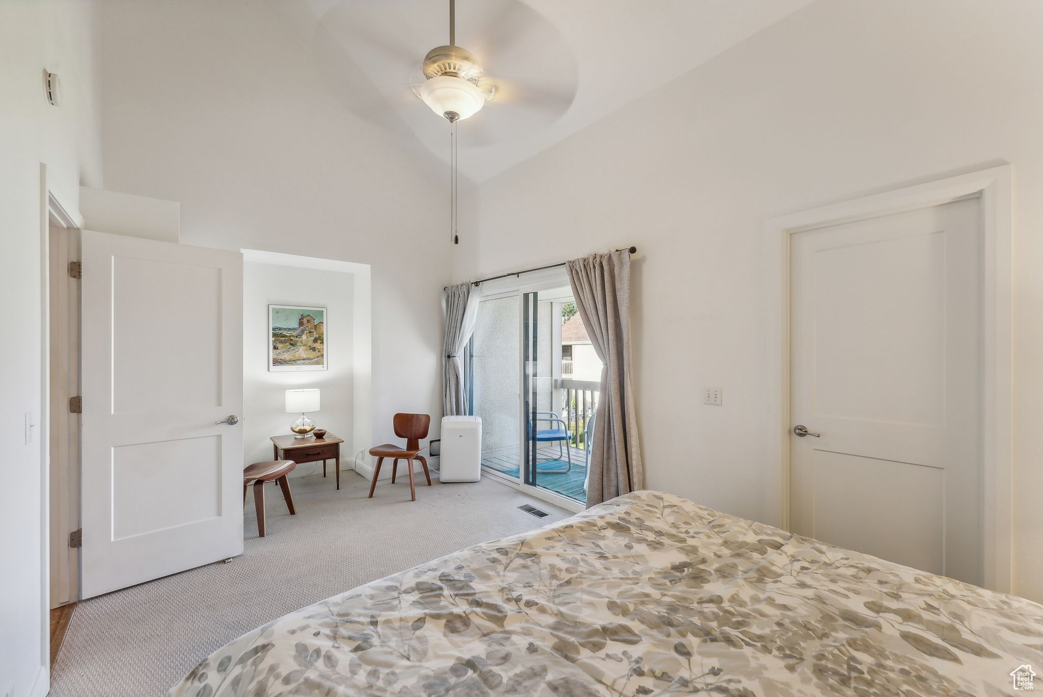 Carpeted bedroom with high vaulted ceiling, access to outside, and ceiling fan
