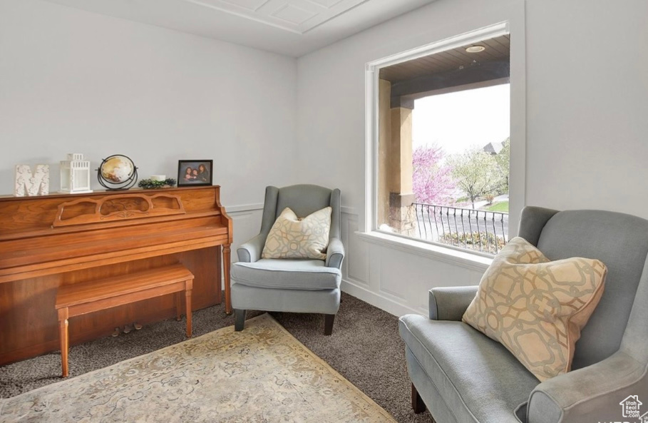 Living area featuring carpet flooring