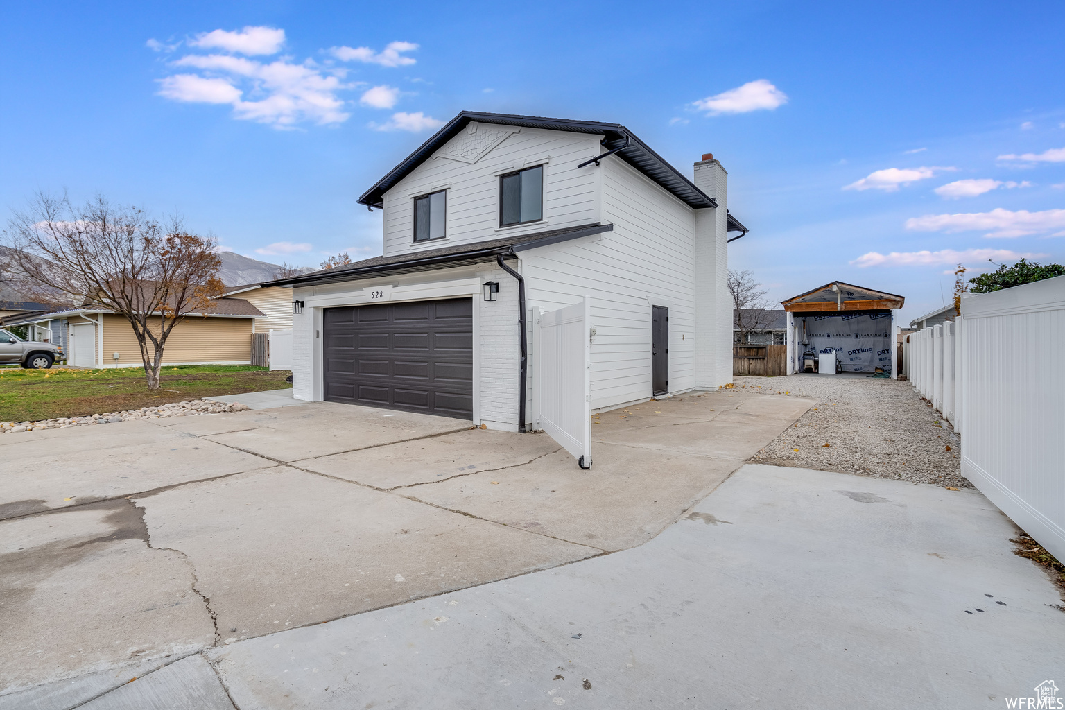 View of side of home with a garage