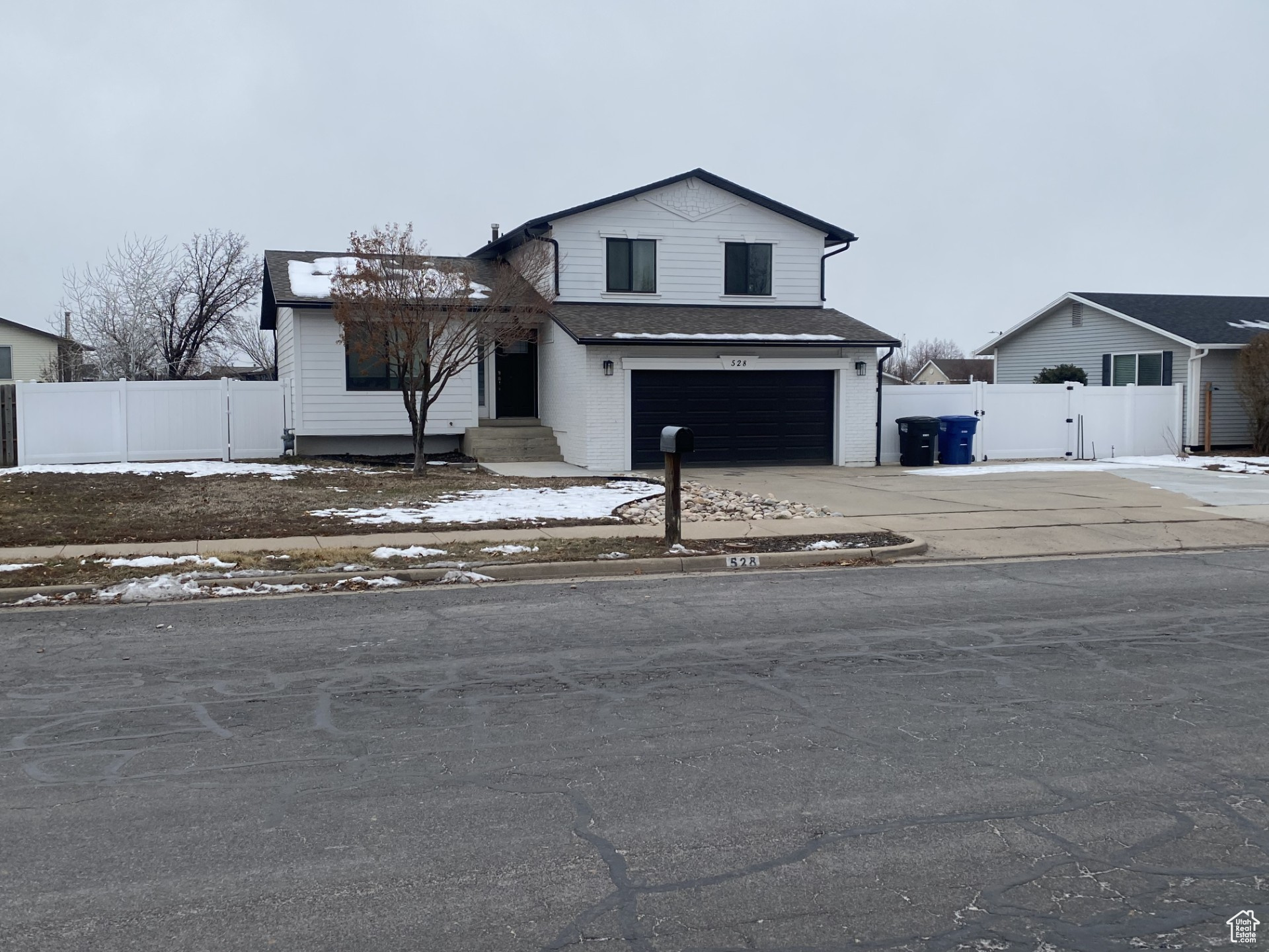 View of front of property featuring a garage