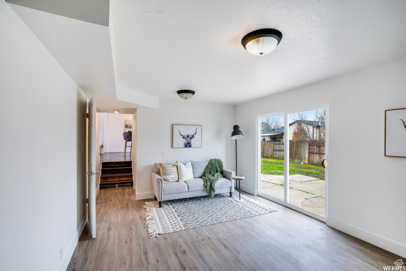 Sitting room featuring light hardwood / wood-style flooring