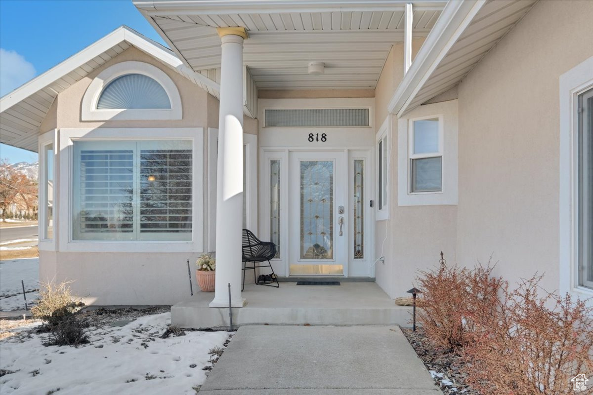 View of snow covered property entrance