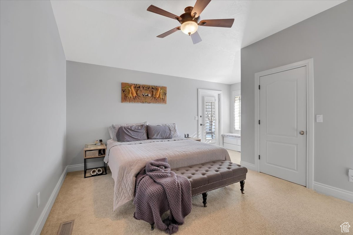 Primary Bedroom featuring en-suite, walk-in closet and access to deck