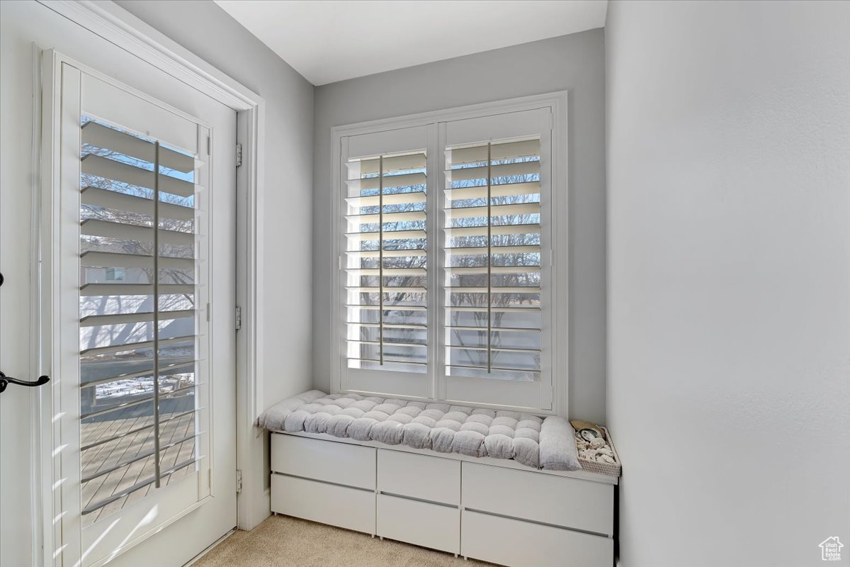 Primary bedroom nook with access to deck