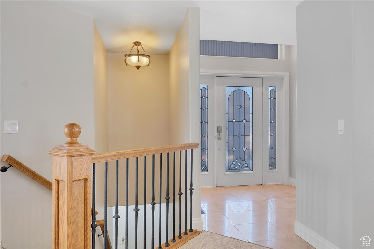 Foyer with light tile patterned floors