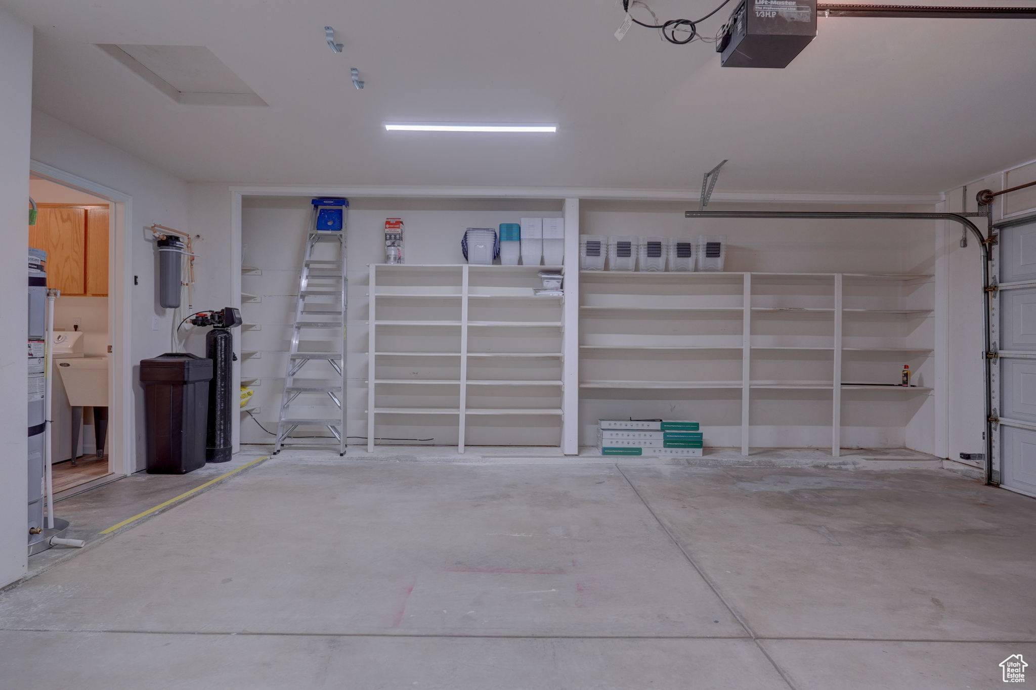 Garage featuring a garage door opener