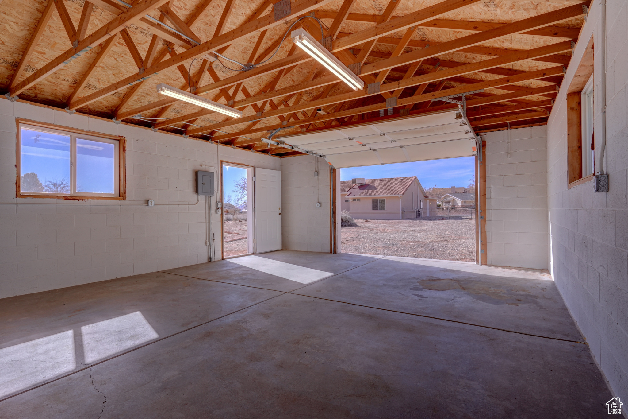 Garage featuring electric panel