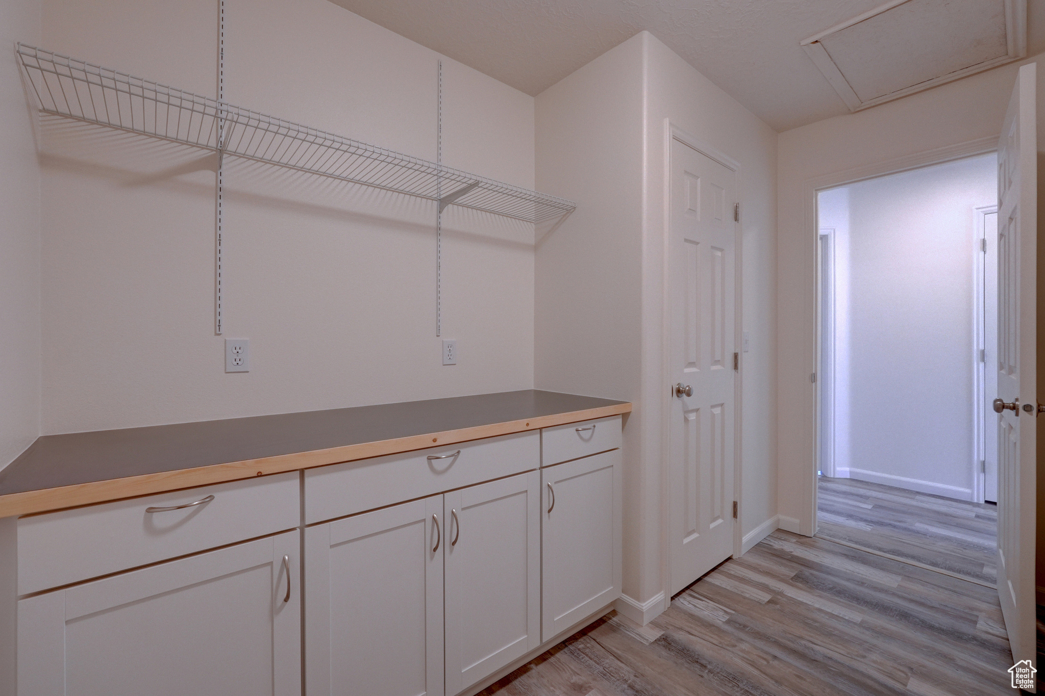 Washroom featuring light hardwood / wood-style floors