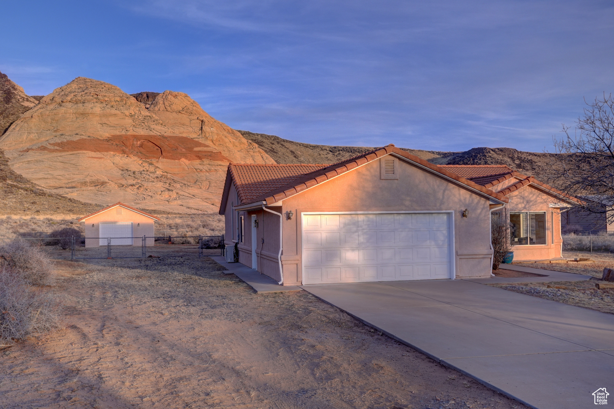 View of front of property featuring a mountain view and a garage