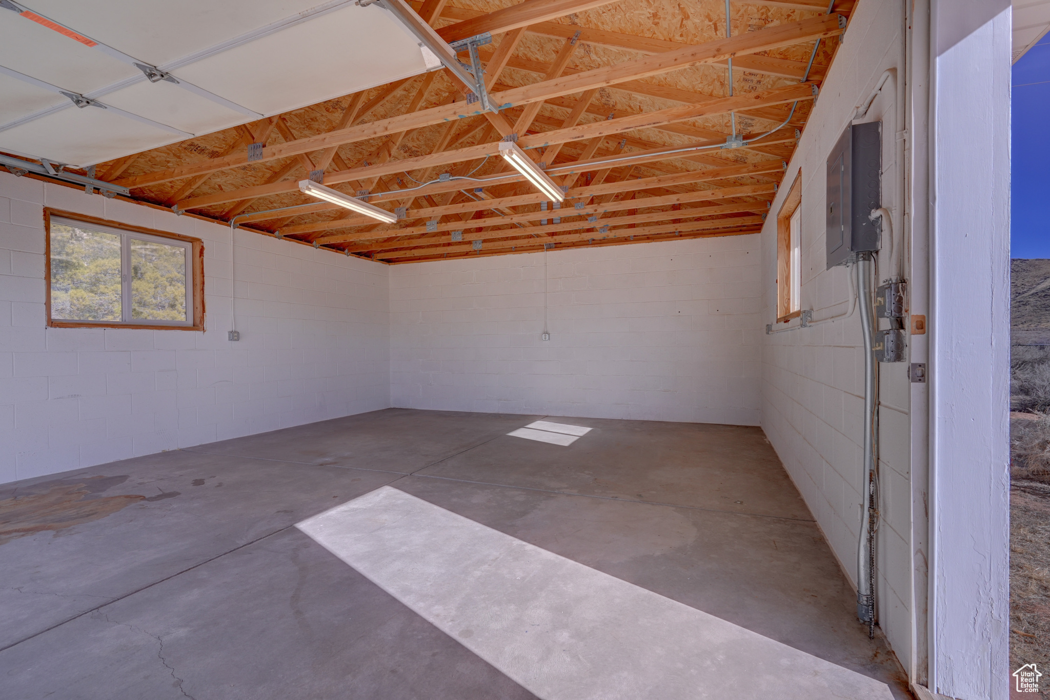 Garage featuring electric panel