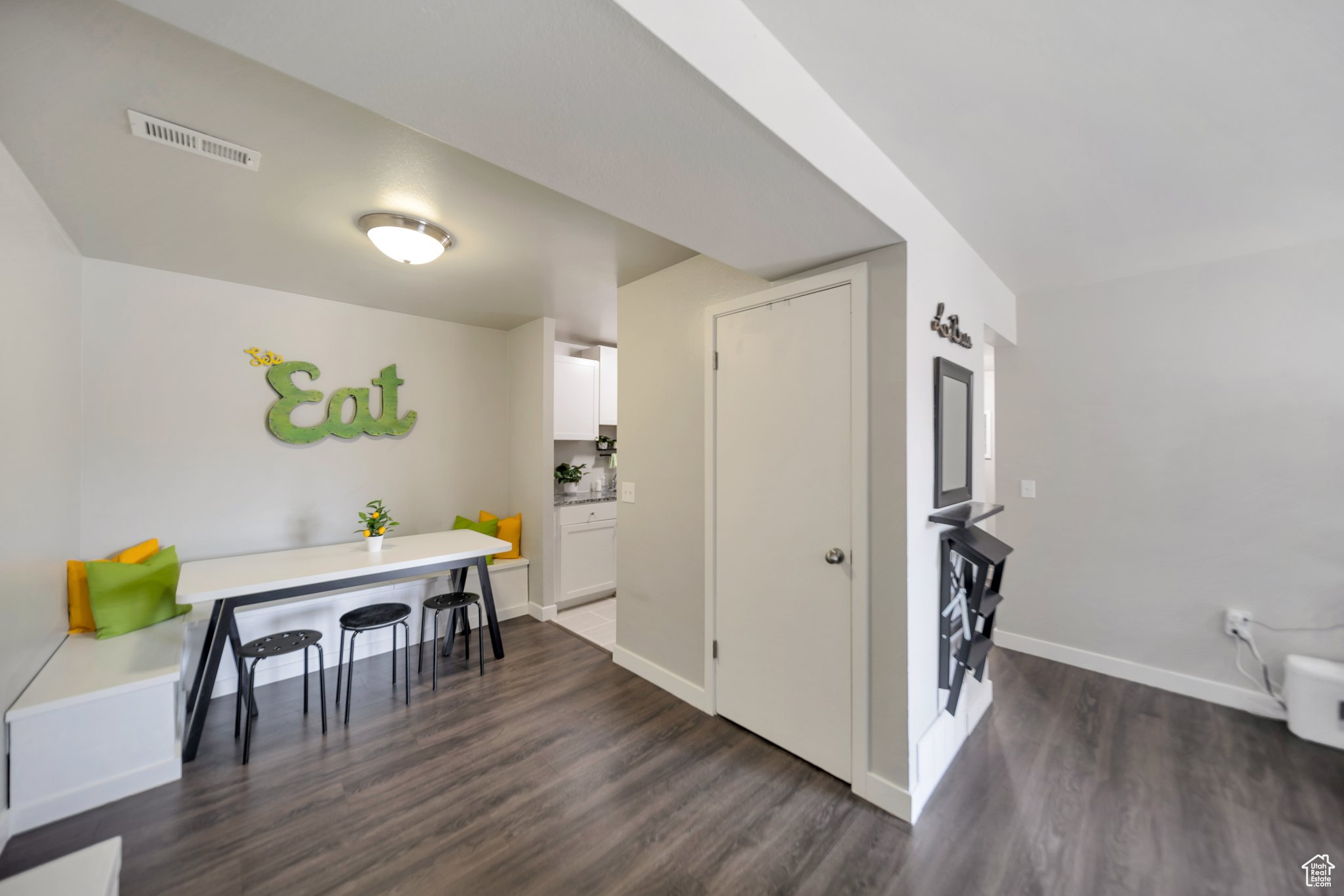 Interior space featuring dark wood-type flooring