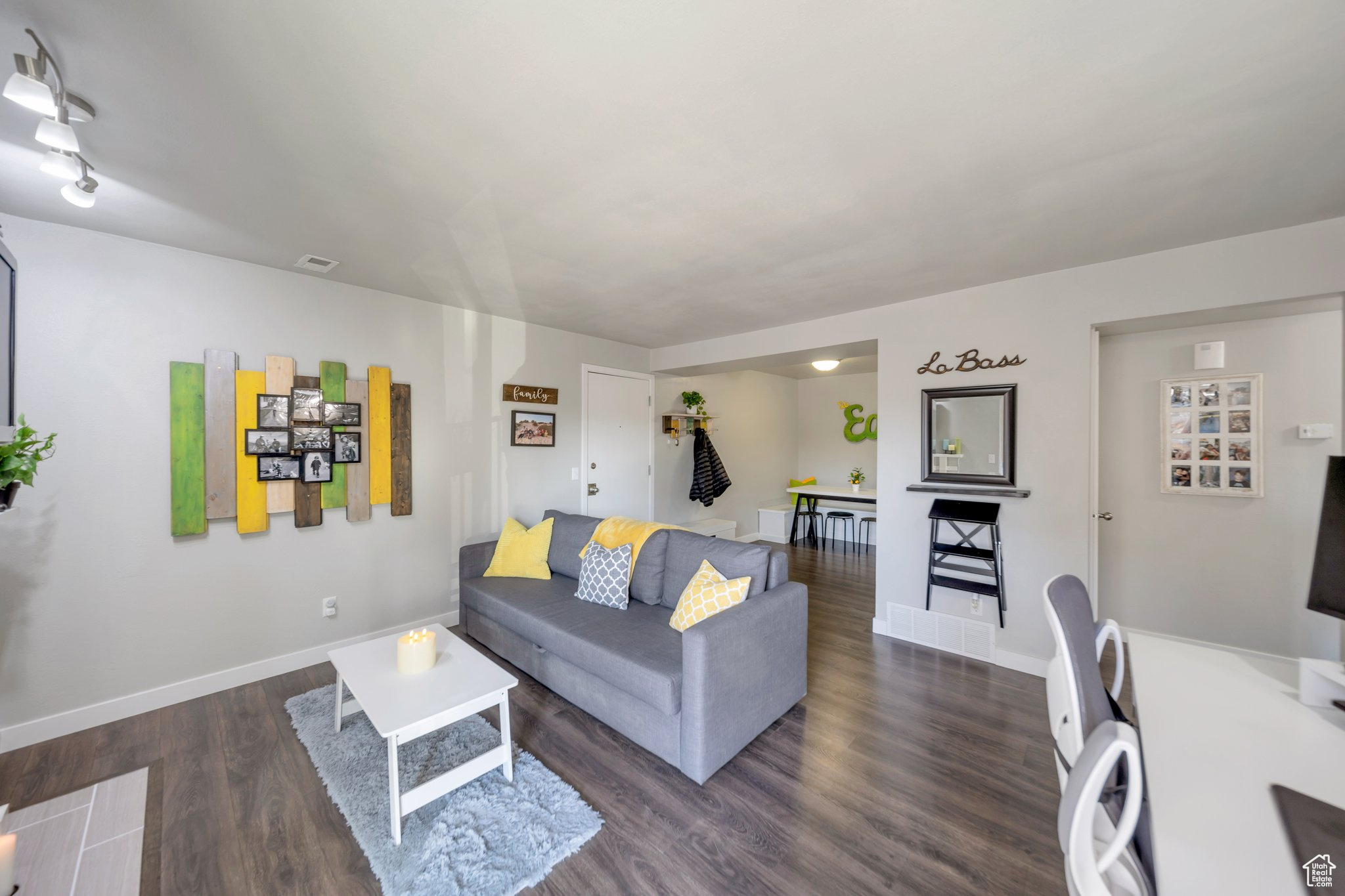 Living room featuring dark wood-type flooring